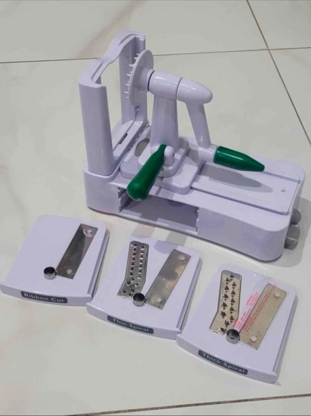 White and Green Handheld Spiralizer with 3 Blade Attachments